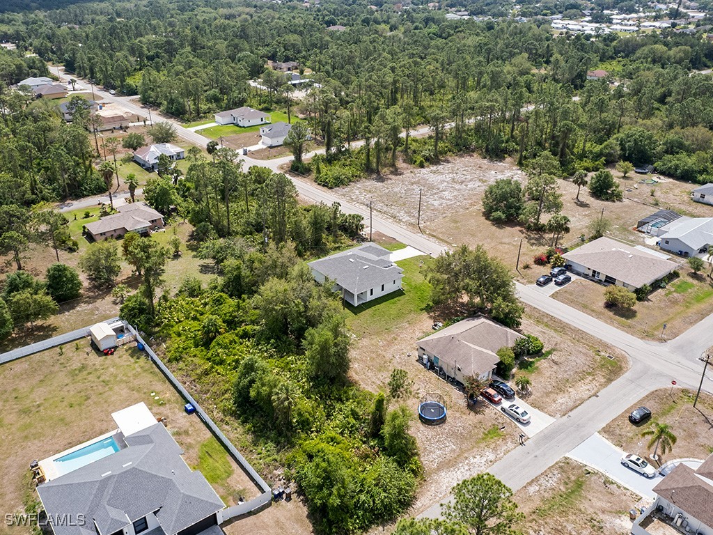 902 Williams Avenue Lehigh Acres, FL 33972 - Photo 22 of 30 an aerial view of residential house with outdoor space