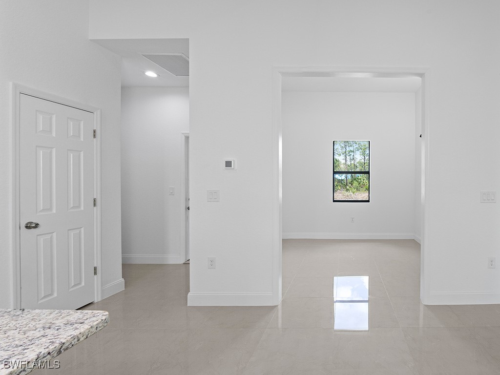 902 Williams Avenue Lehigh Acres, FL 33972 - Photo 27 of 30 a view of entryway with kitchen