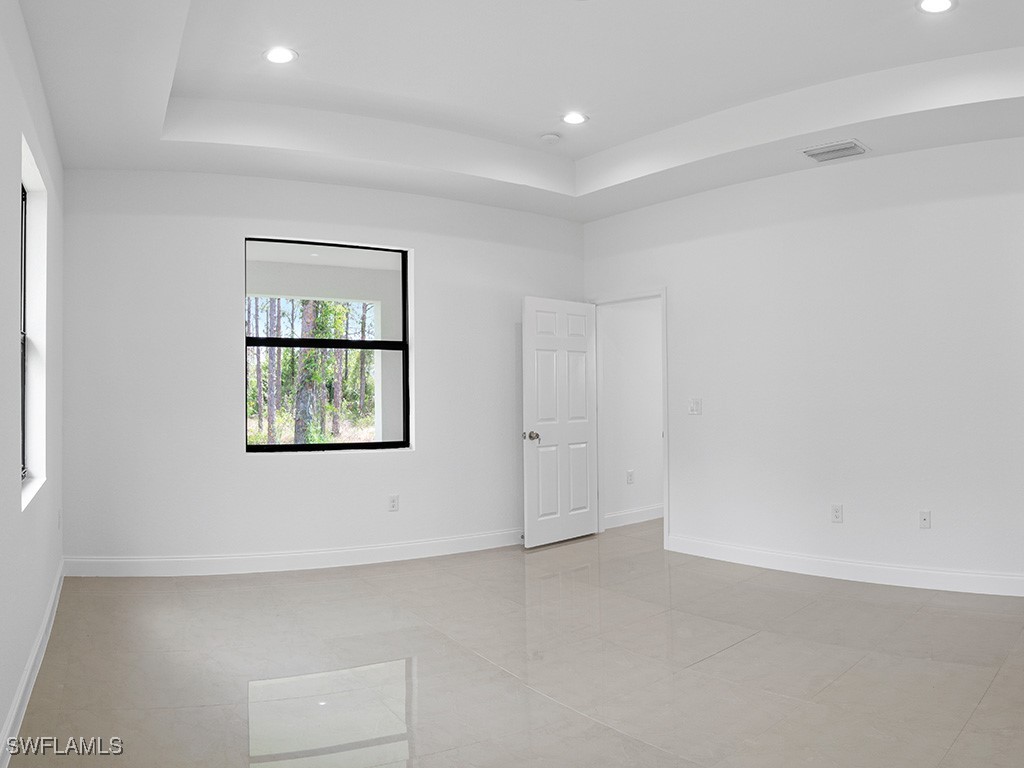 902 Williams Avenue Lehigh Acres, FL 33972 - Photo 28 of 30 an empty room with windows and closet