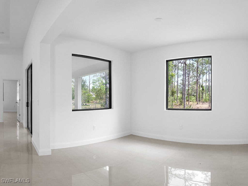 902 Williams Avenue Lehigh Acres, FL 33972 - Photo 29 of 30 a view of an empty room with a window