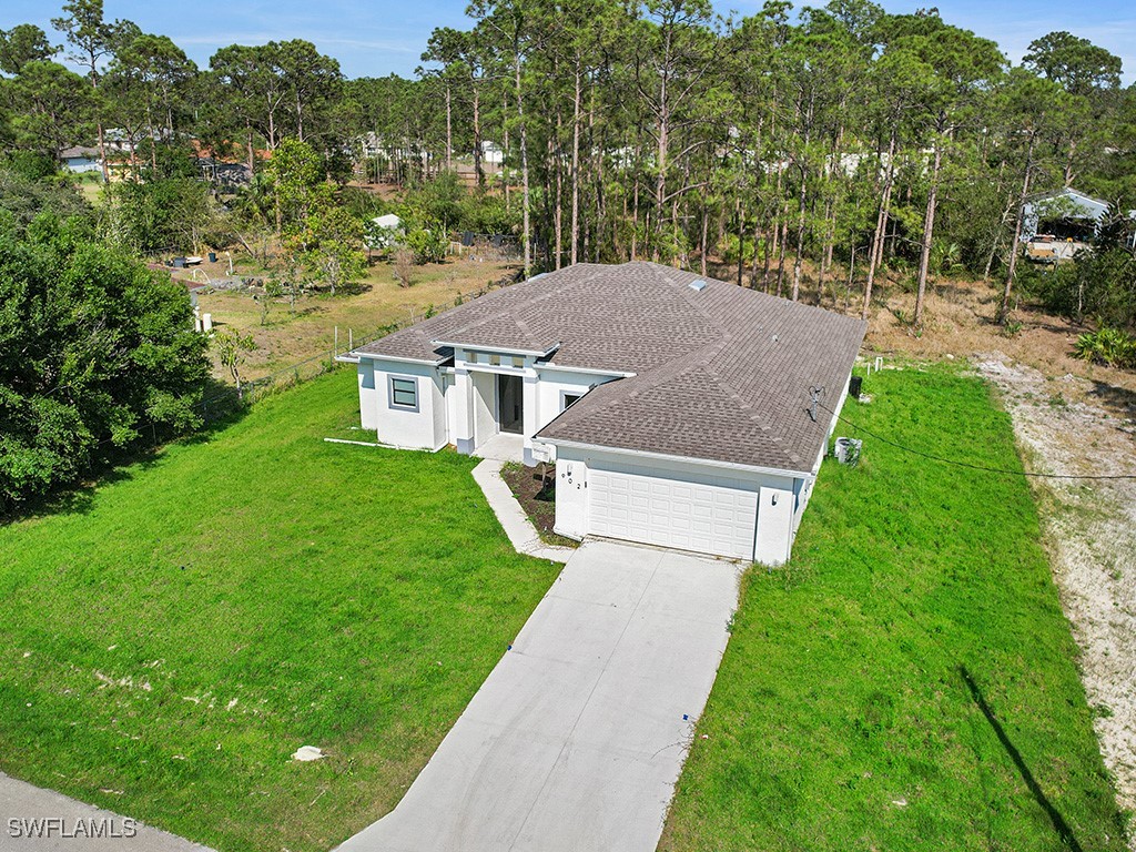 902 Williams Avenue Lehigh Acres, FL 33972 - Photo 3 of 30 an aerial view of a house