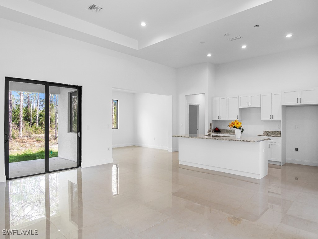 902 Williams Avenue Lehigh Acres, FL 33972 - Photo 8 of 30 a living room with furniture and a large window