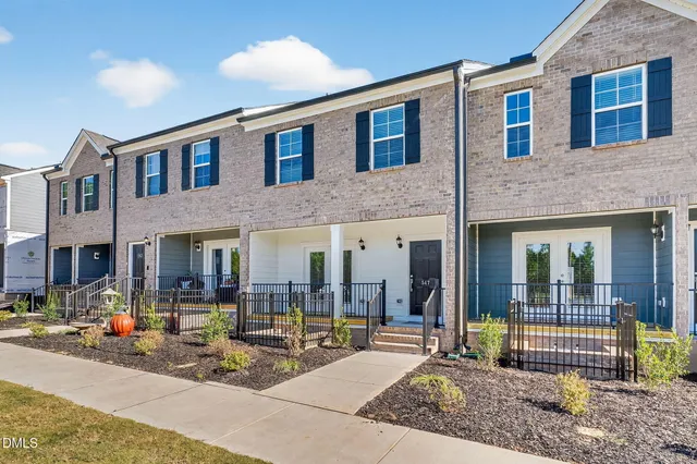 a view of a building with sitting area