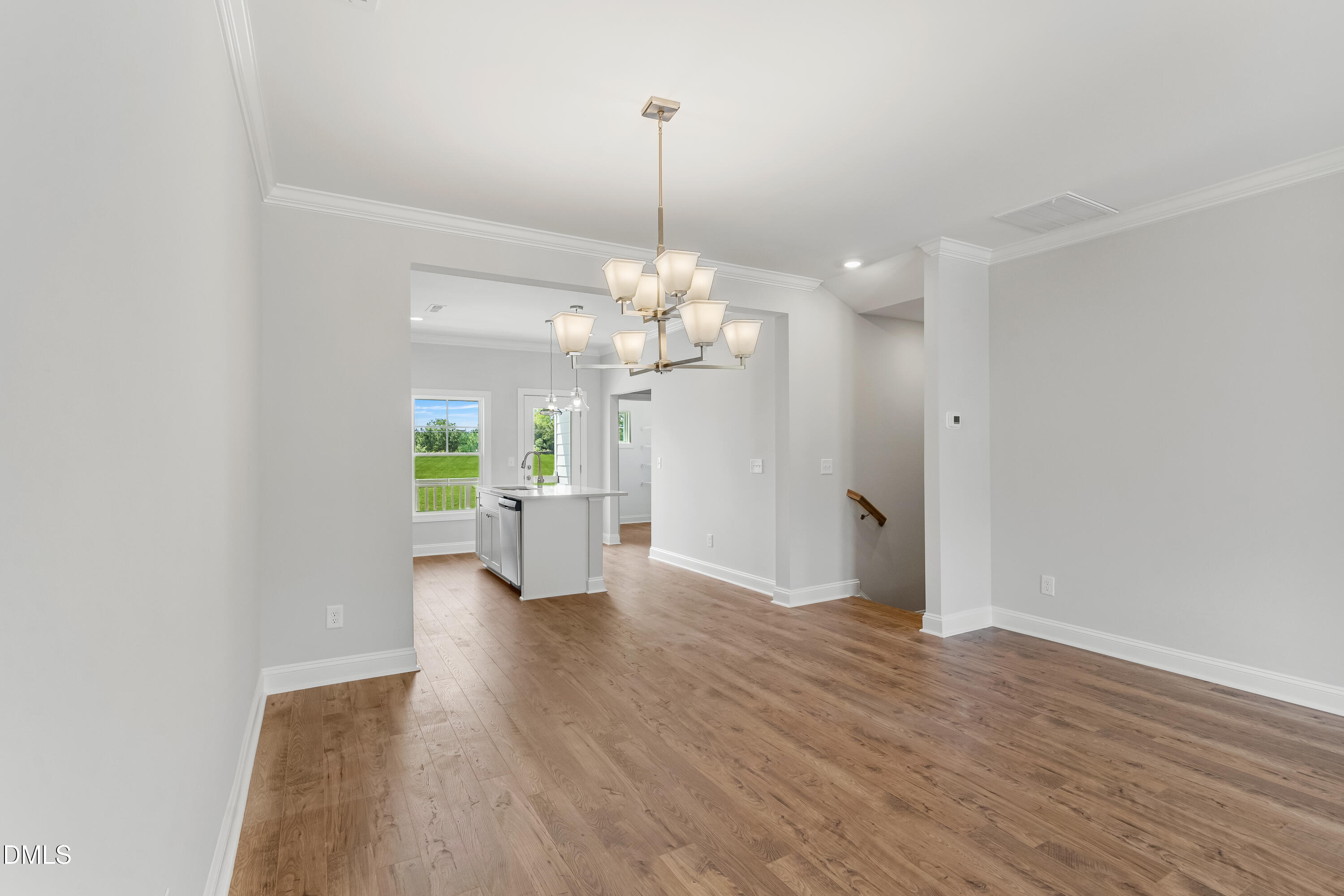 519 Forestville Road Wake Forest, NC 27587 - Photo 10 of 38 a view of a livingroom with a chandelier fan and a window