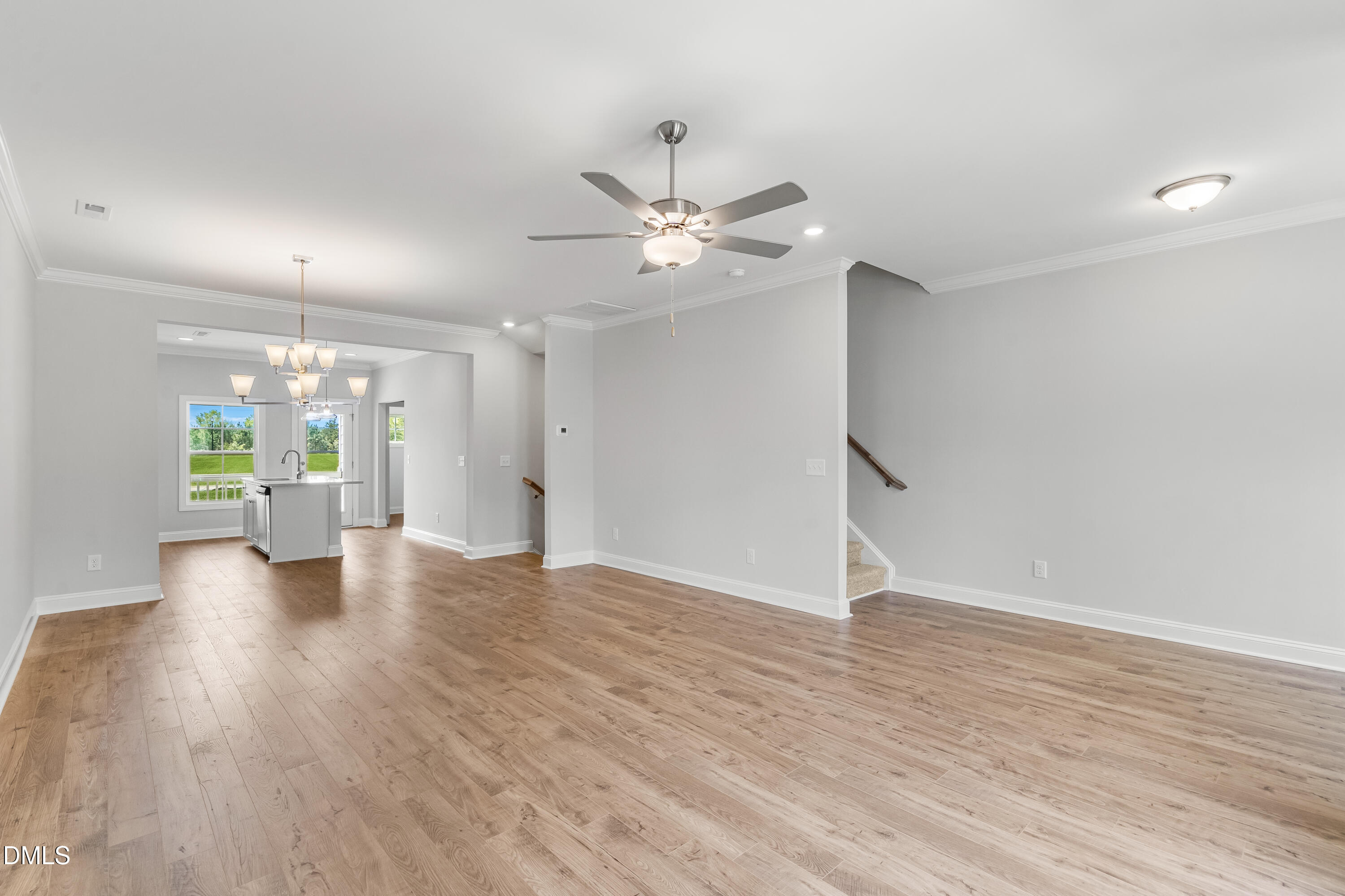519 Forestville Road Wake Forest, NC 27587 - Photo 14 of 38 a view of an empty room with window and wooden floor