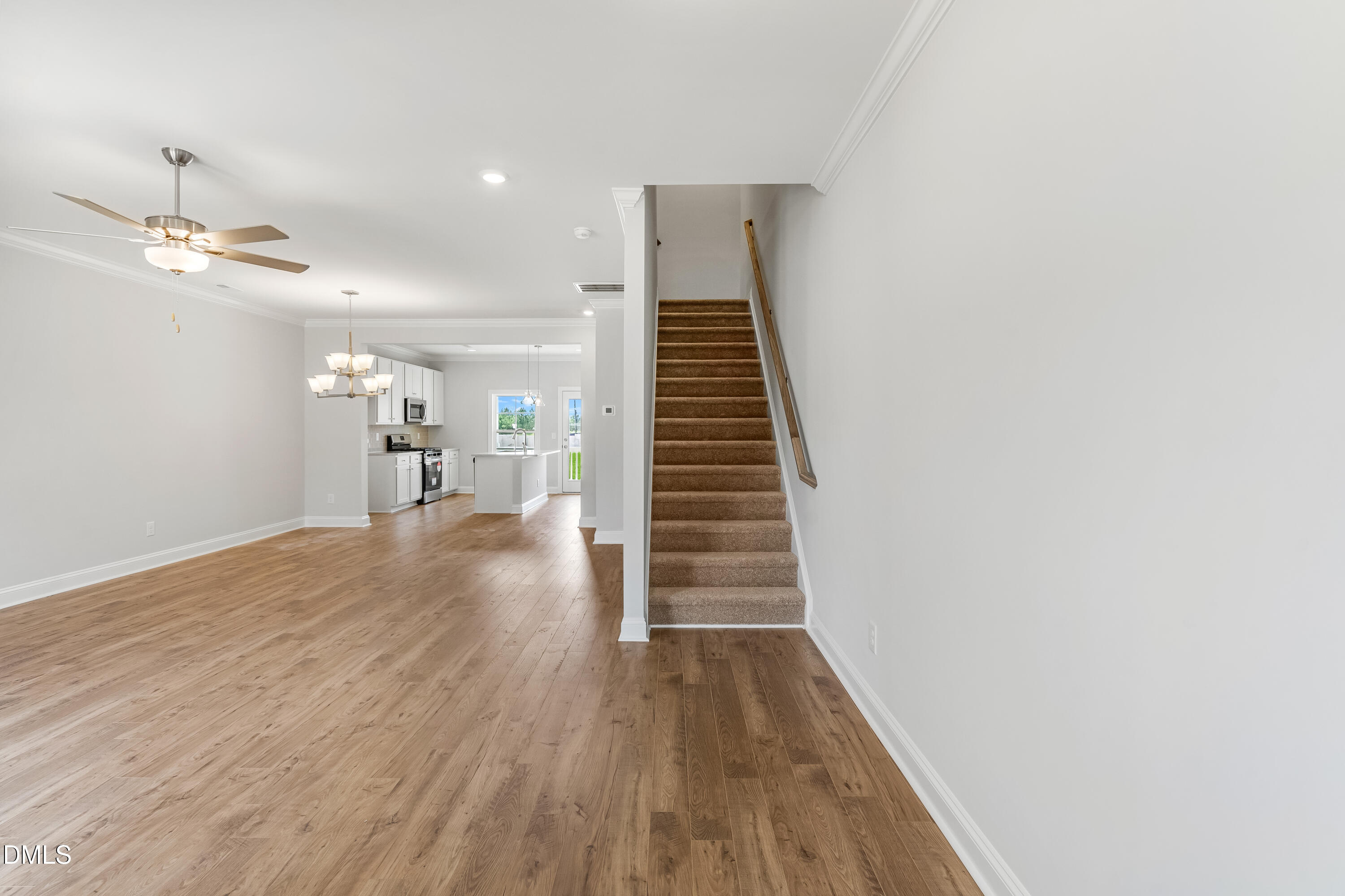 519 Forestville Road Wake Forest, NC 27587 - Photo 18 of 38 a view of a hallway with wooden floor and staircase