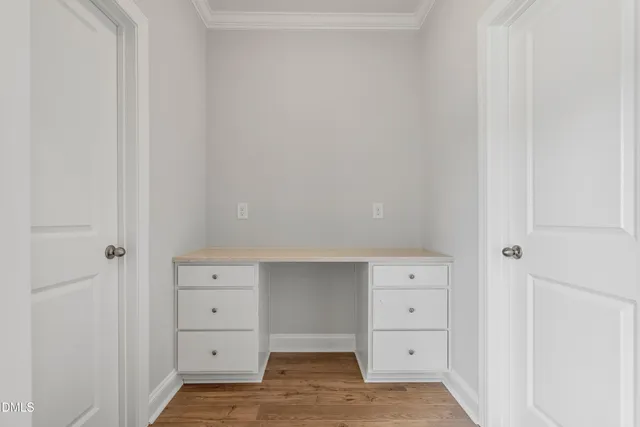 wooden floor with white cabinet