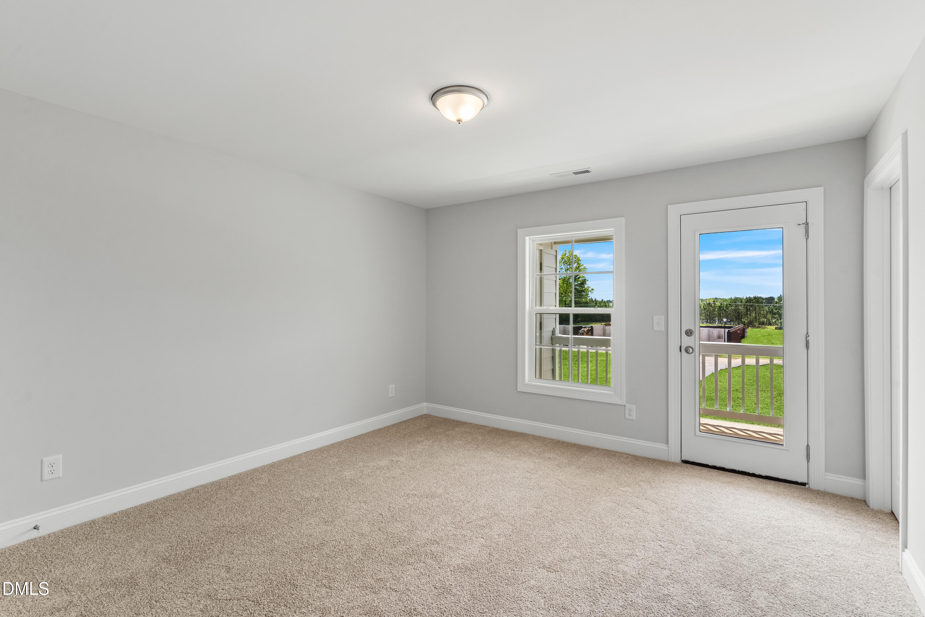 519 Forestville Road Wake Forest, NC 27587 - Photo 29 of 38 an empty room with windows and closet