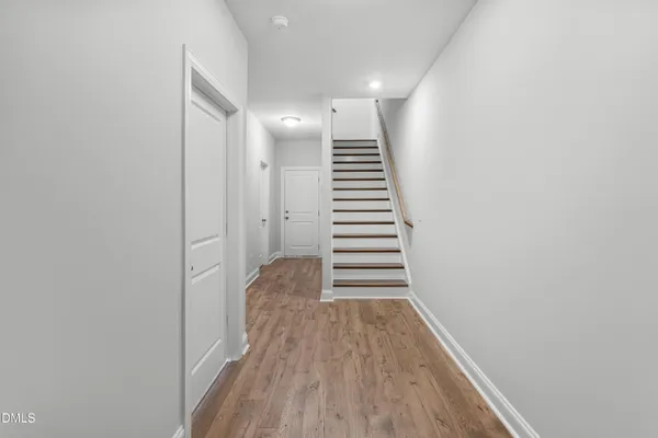a view of entryway with wooden floor