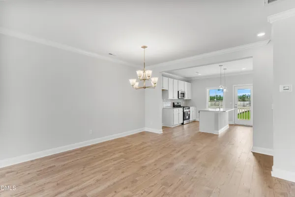 a view of a kitchen with wooden floor
