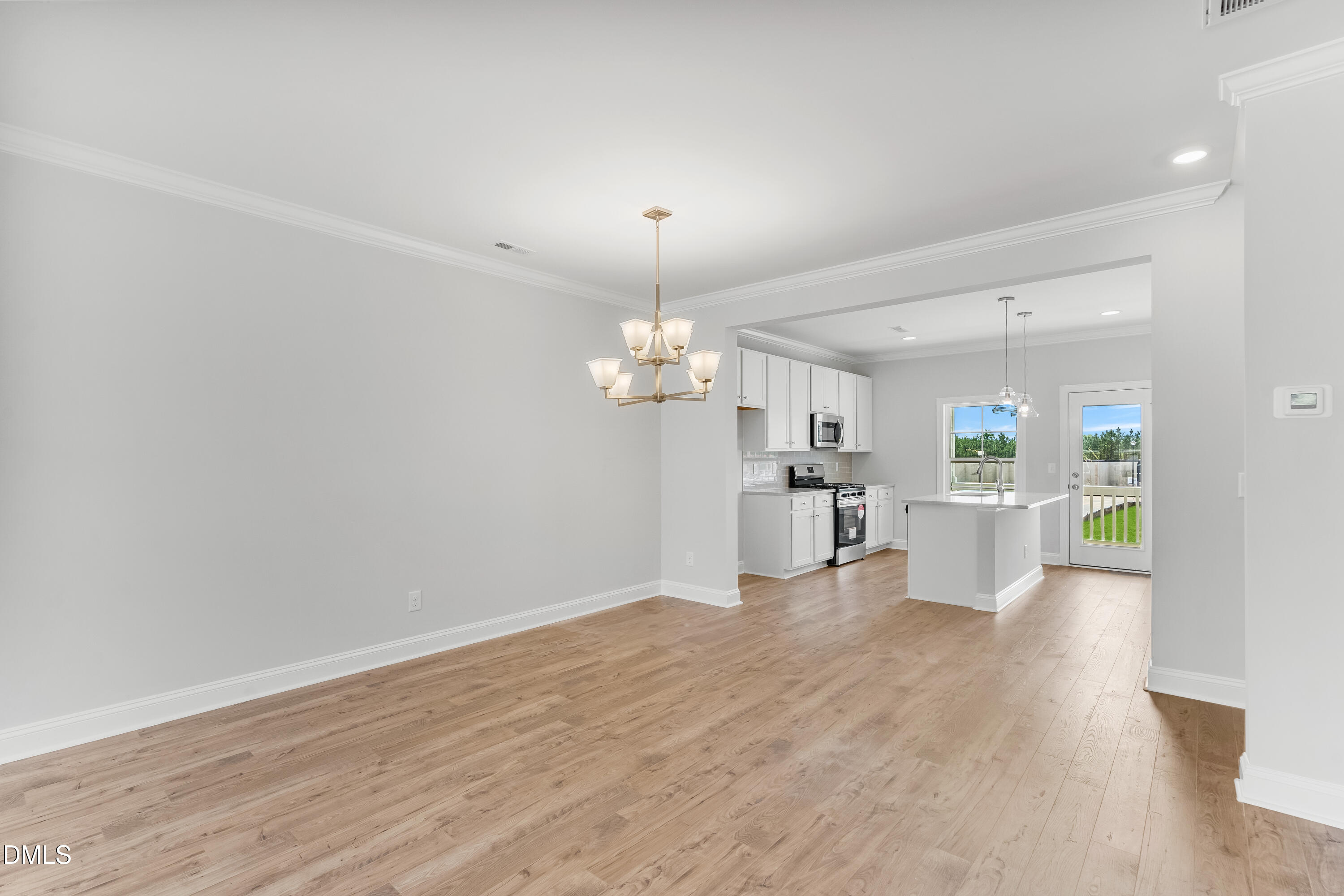 519 Forestville Road Wake Forest, NC 27587 - Photo 9 of 38 a view of a kitchen with wooden floor