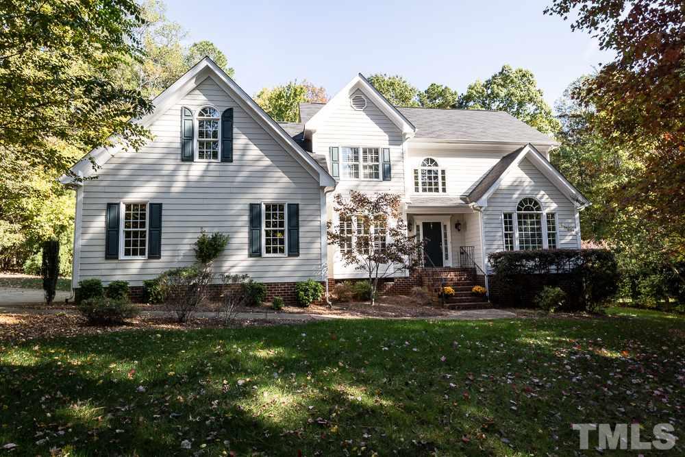 5020 Big Creek Road Raleigh, NC 27613 - Photo 1 of 25 a front view of a house with a yard and outdoor seating