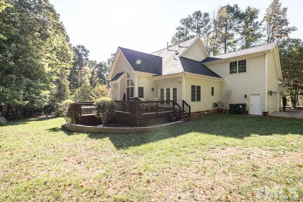 5020 Big Creek Road Raleigh, NC 27613 - Photo 2 of 25 a view of a house with a yard