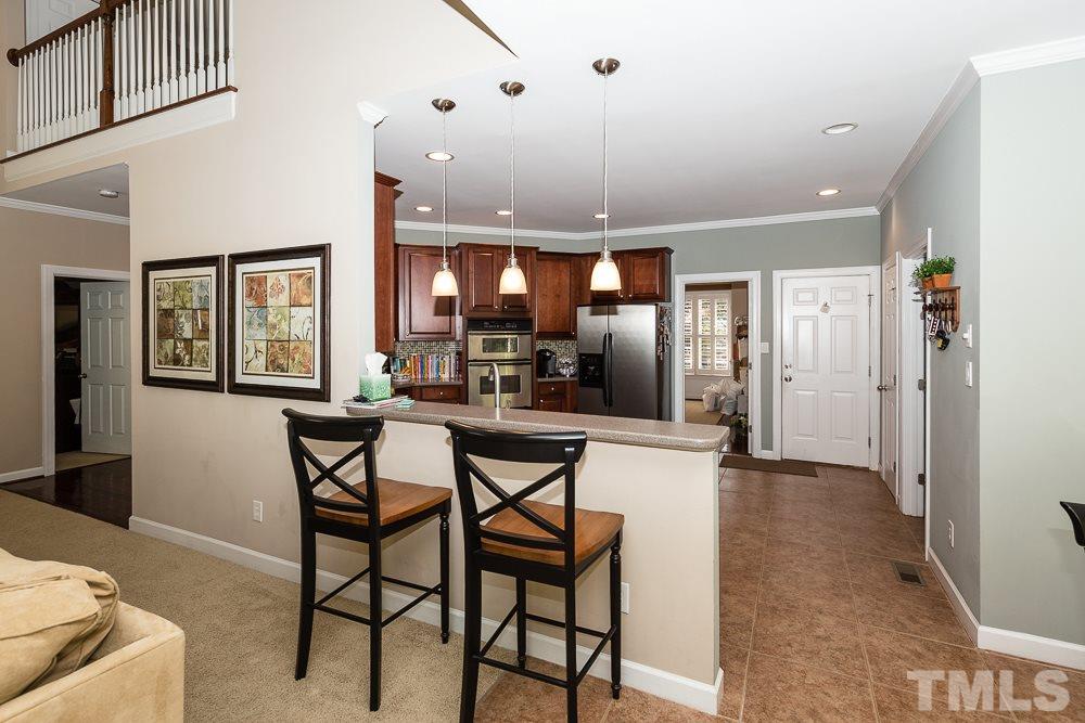 5020 Big Creek Road Raleigh, NC 27613 - Photo 11 of 25 a view of a dining room with furniture