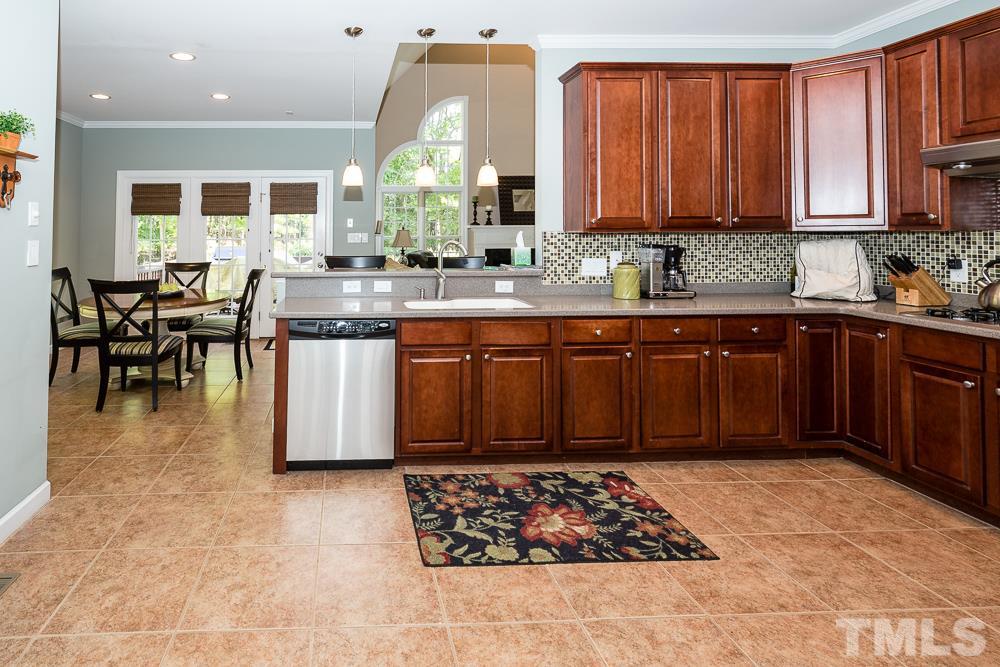 5020 Big Creek Road Raleigh, NC 27613 - Photo 14 of 25 a kitchen with a sink and cabinets