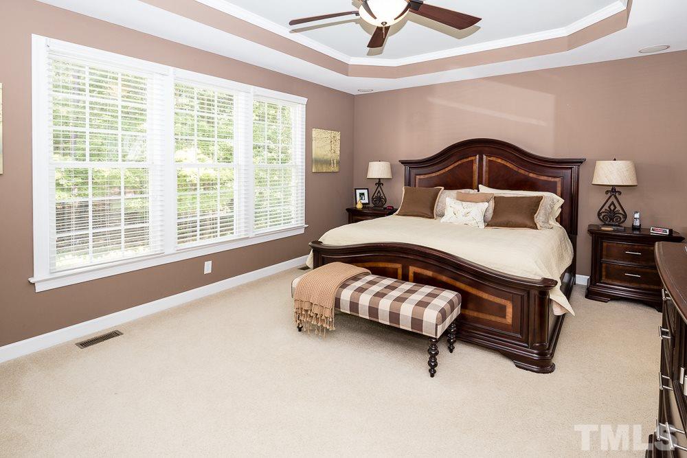 5020 Big Creek Road Raleigh, NC 27613 - Photo 16 of 25 a bedroom with a bed and window