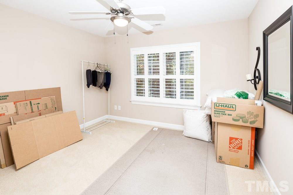 5020 Big Creek Road Raleigh, NC 27613 - Photo 24 of 25 a living room with a bed furniture and a window
