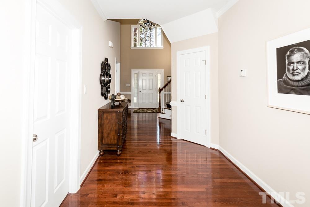 5020 Big Creek Road Raleigh, NC 27613 - Photo 4 of 25 a view of a hallway with wooden floor