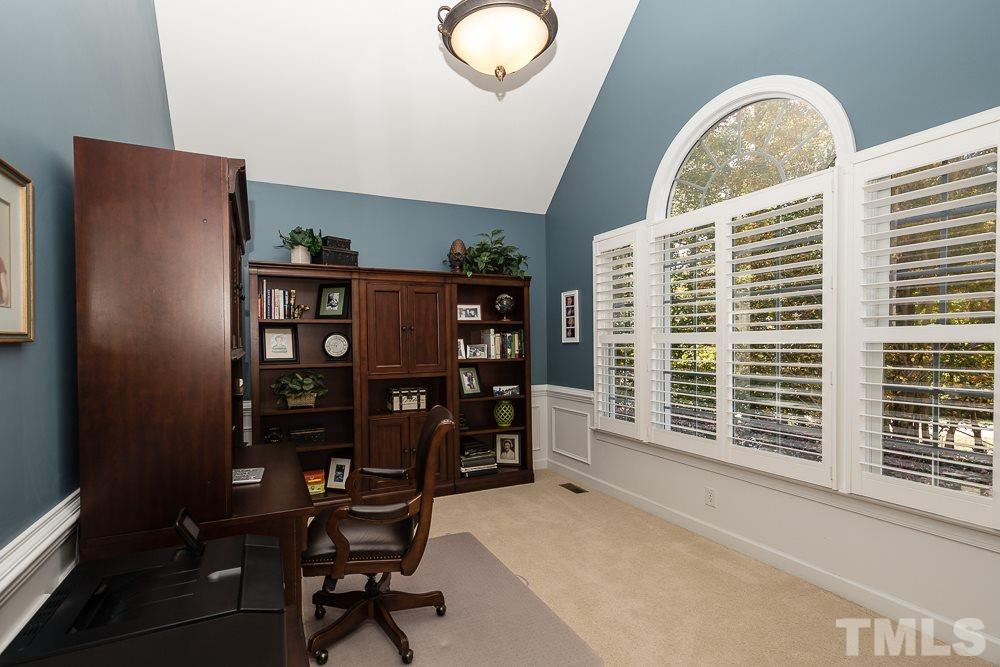 5020 Big Creek Road Raleigh, NC 27613 - Photo 6 of 25 a view of a workspace with furniture and a window
