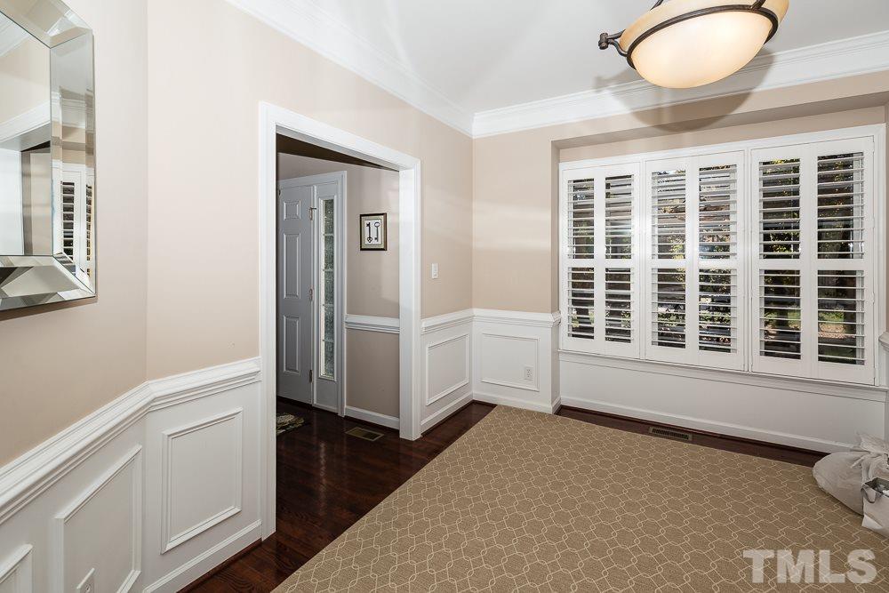 5020 Big Creek Road Raleigh, NC 27613 - Photo 7 of 25 a view of an entryway with wooden floor and cabinet