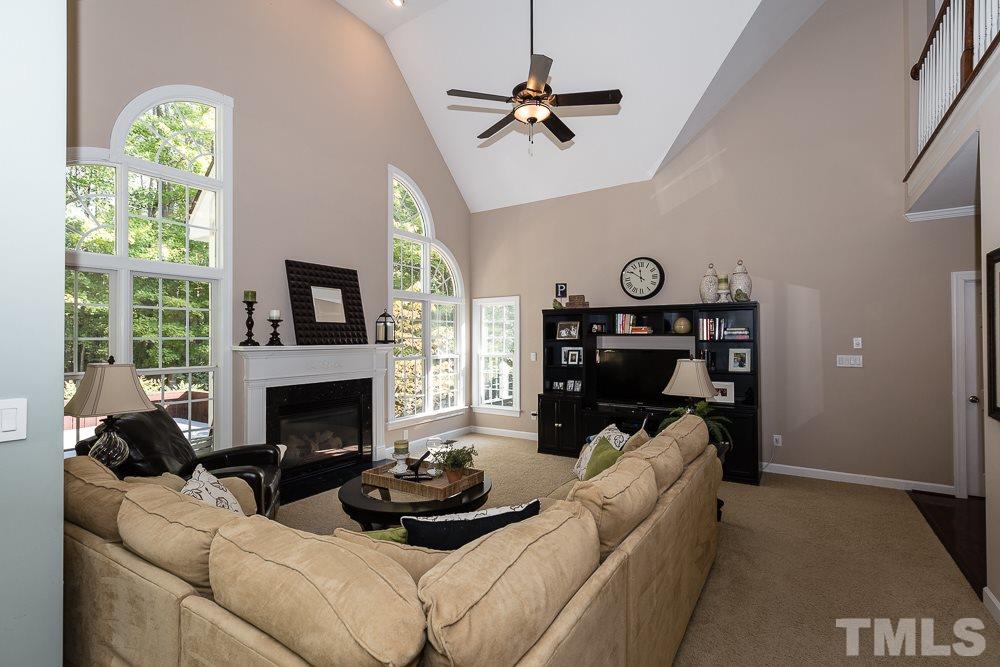 5020 Big Creek Road Raleigh, NC 27613 - Photo 10 of 25 a living room with furniture and a fireplace