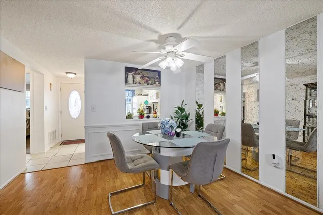 a view of a dining room with furniture and wooden floor