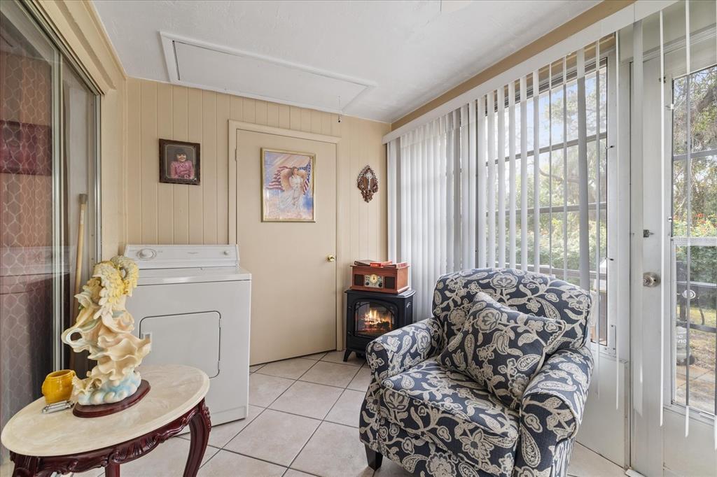 4231 Richmere Drive, Unit 3D New Port Richey, FL 34652 - Photo 20 of 31 a living room with furniture and a large window