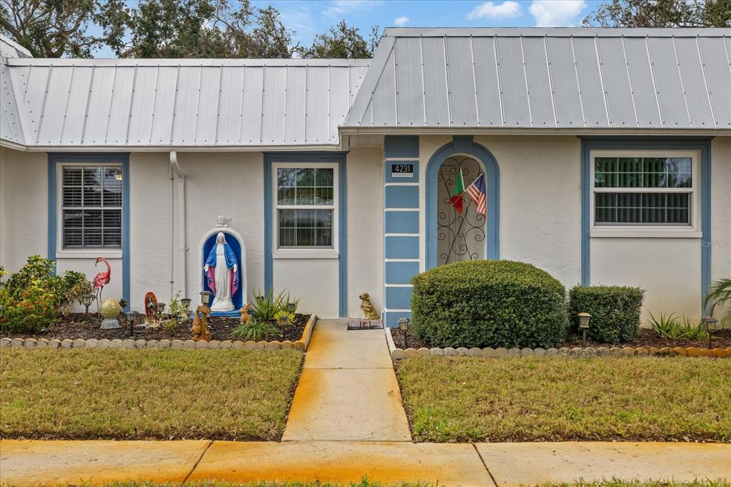 4231 Richmere Drive, Unit 3D New Port Richey, FL 34652 - Photo 2 of 31 a front view of a house with natural light