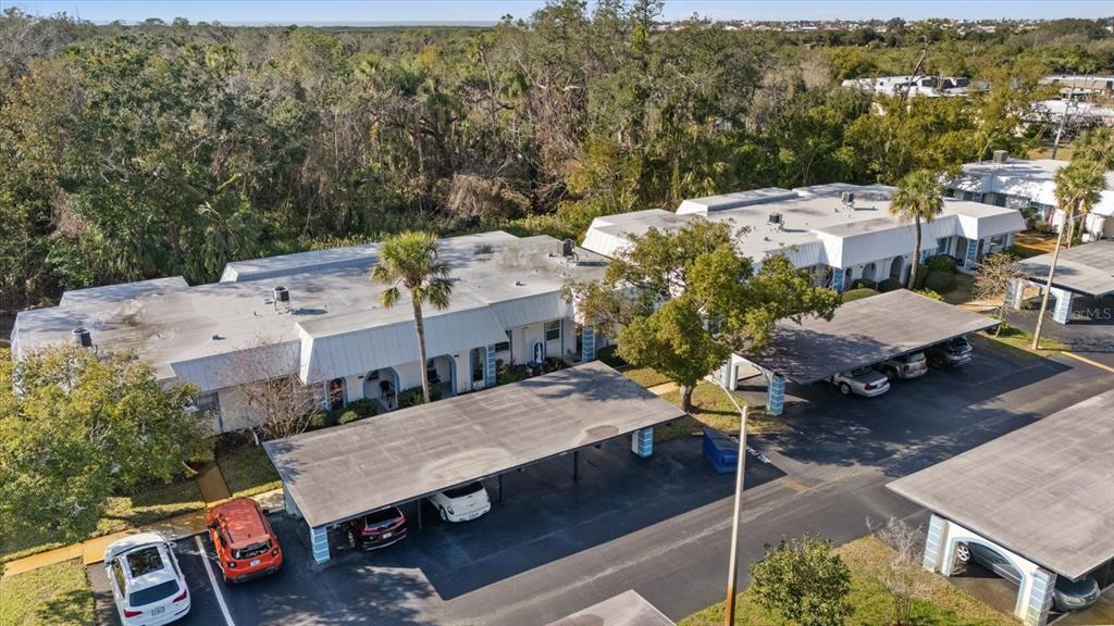 4231 Richmere Drive, Unit 3D New Port Richey, FL 34652 - Photo 27 of 31 an aerial view of a house with table and chairs