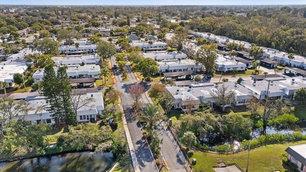 4231 Richmere Drive, Unit 3D New Port Richey, FL 34652 - Photo 28 of 31 an aerial view of residential houses with outdoor space