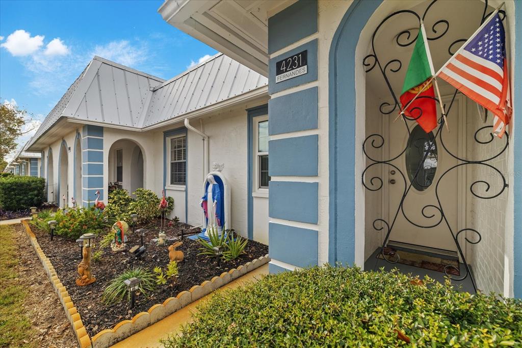 4231 Richmere Drive, Unit 3D New Port Richey, FL 34652 - Photo 3 of 31 a front view of a house with garden
