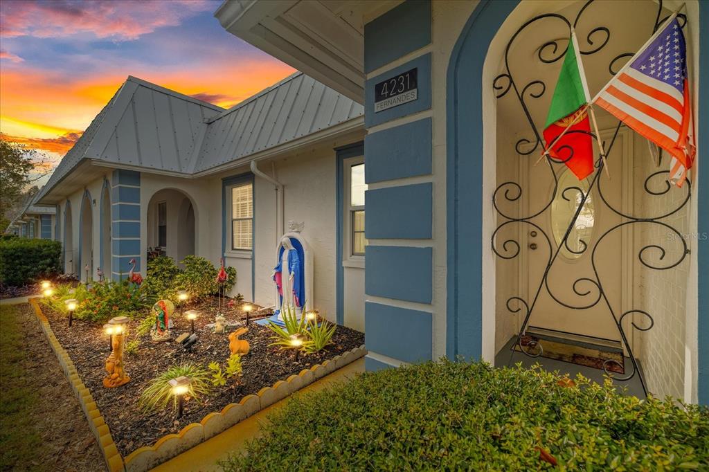 4231 Richmere Drive, Unit 3D New Port Richey, FL 34652 - Photo 4 of 31 a view of a brick house with potted plants