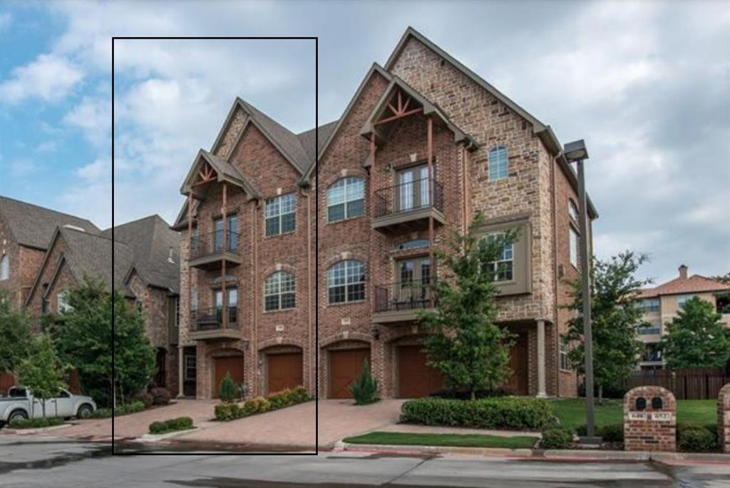 a view of multiple houses with a street