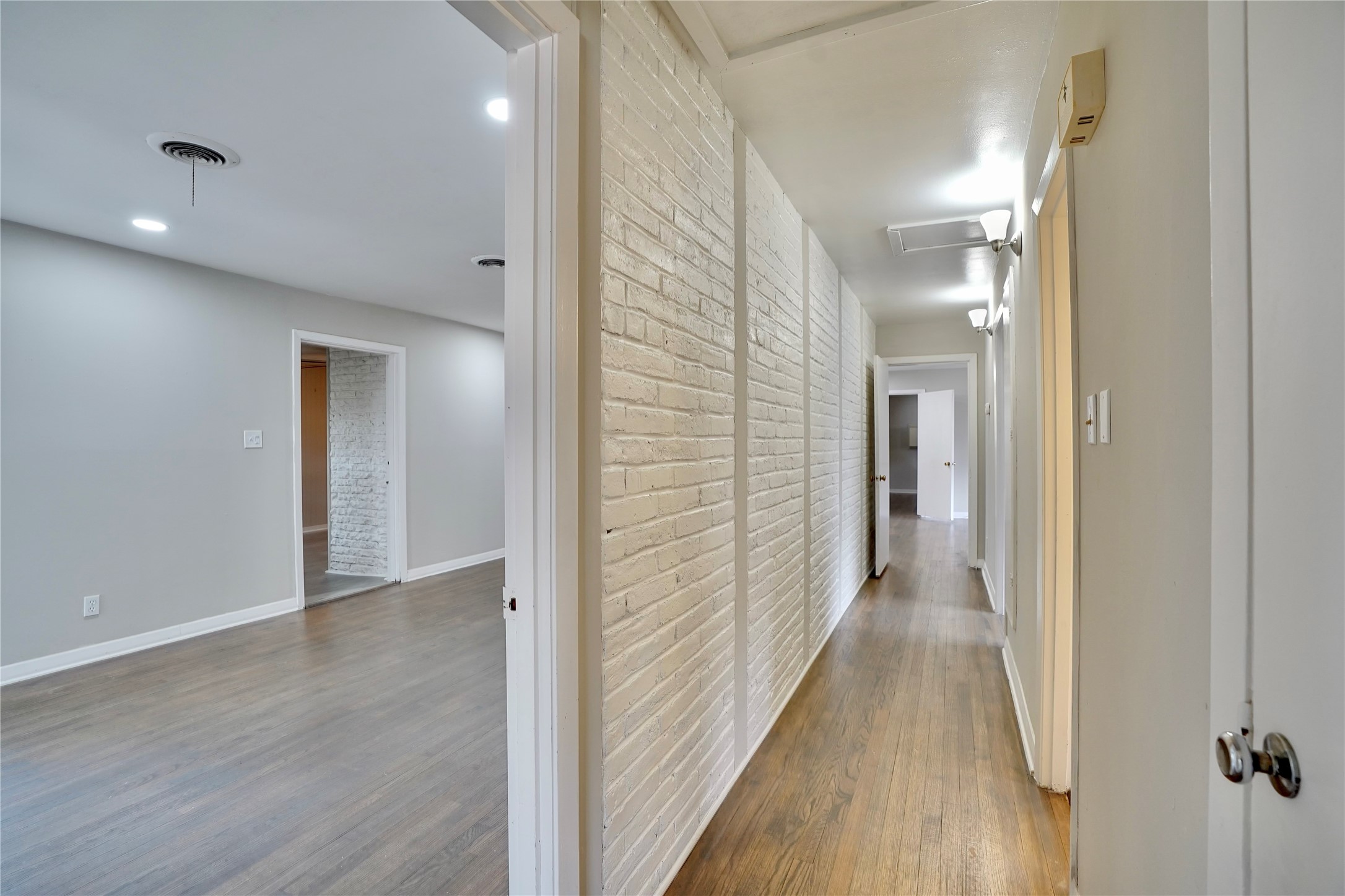 4550 Spellman Road Houston, TX 77035 - Photo 22 of 27 a view of a hallway with wooden floor