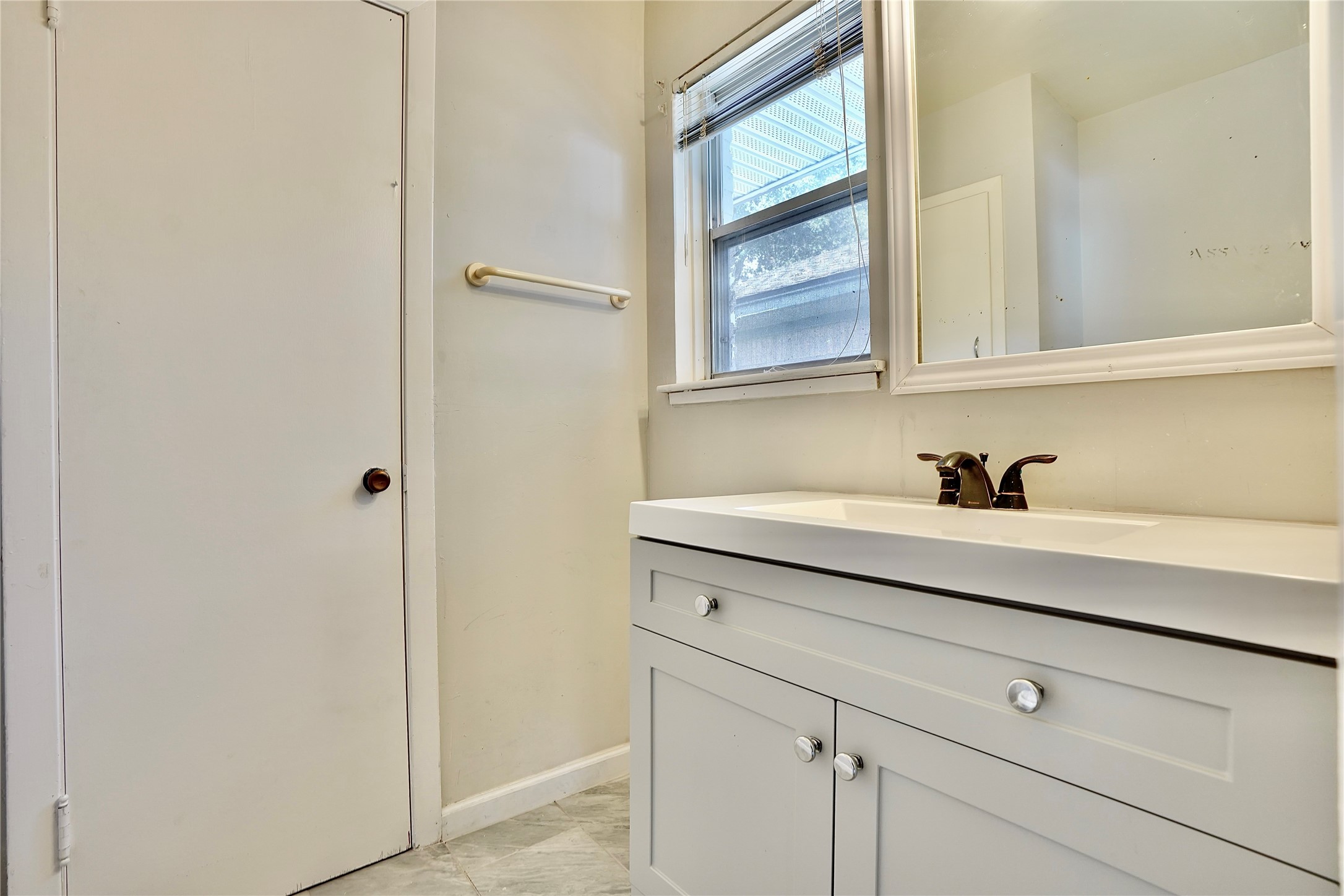 4550 Spellman Road Houston, TX 77035 - Photo 26 of 27 a view of white cabinets and sink