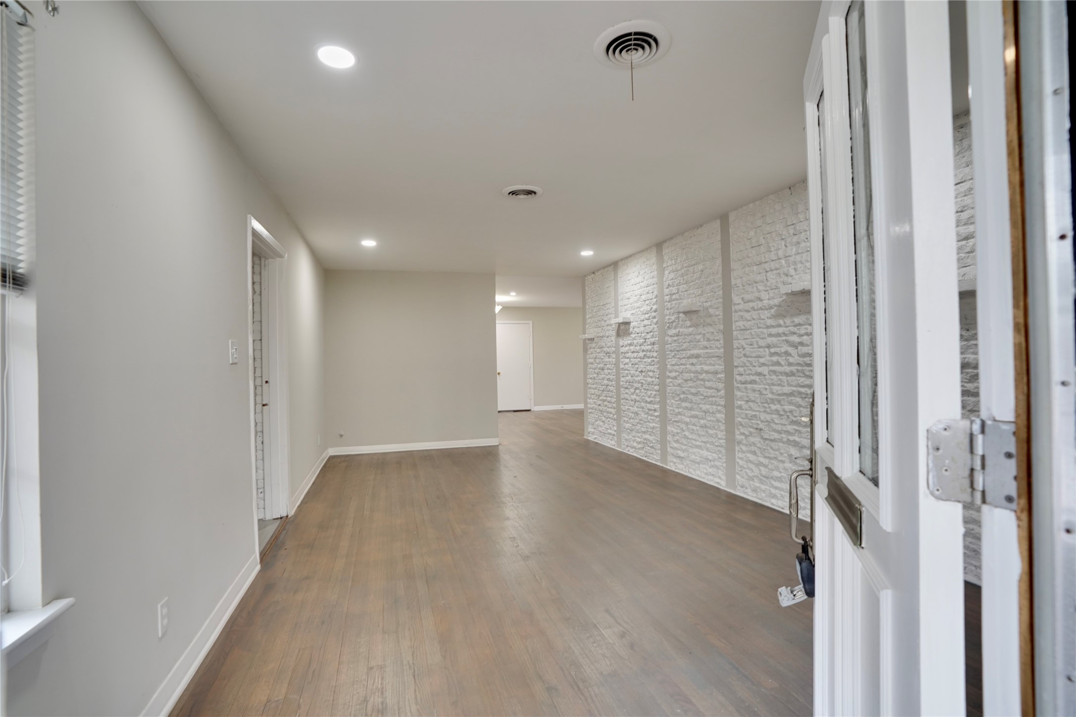 4550 Spellman Road Houston, TX 77035 - Photo 5 of 27 a view of a hallway with wooden floor