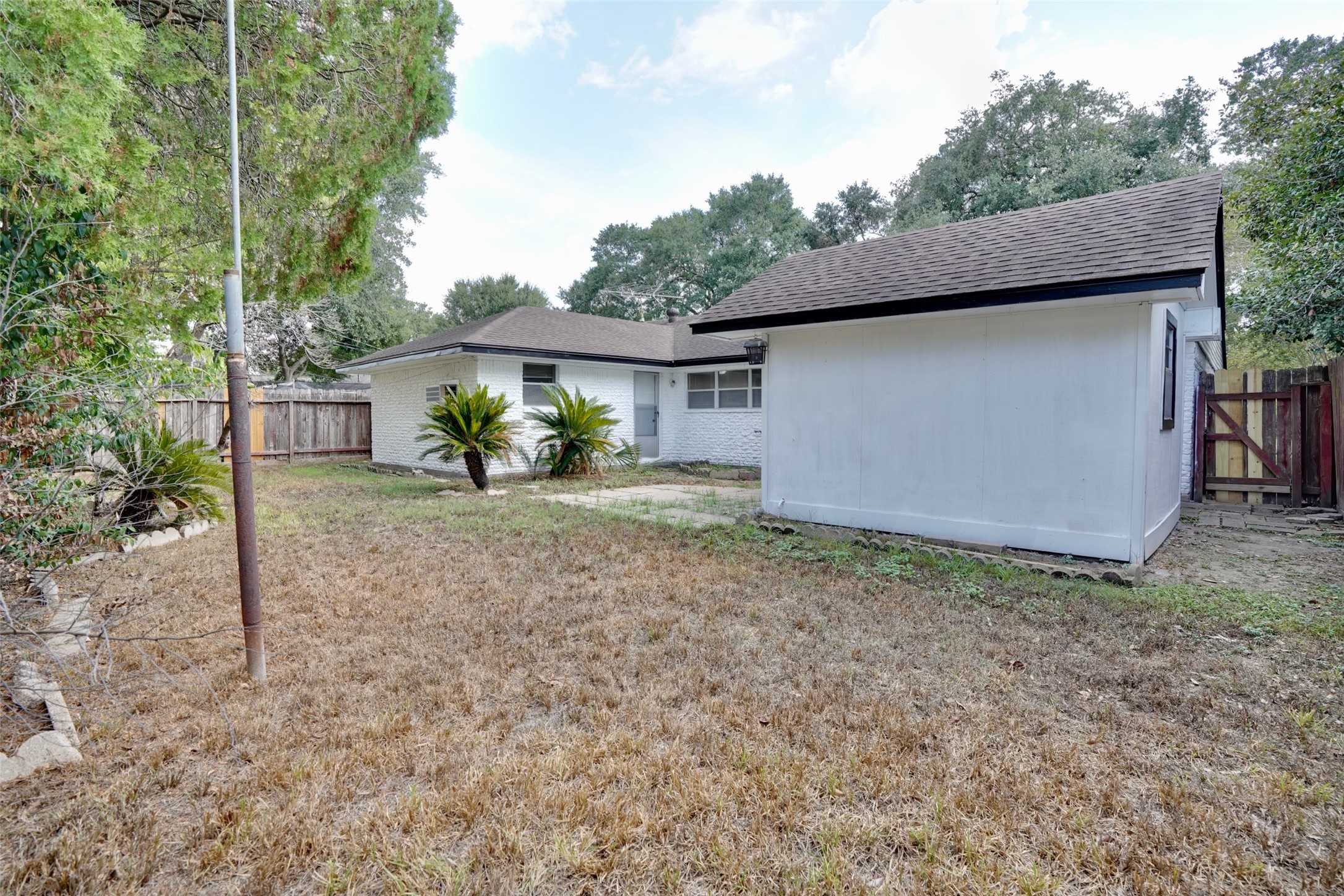 4550 Spellman Road Houston, TX 77035 - Photo 6 of 27 a view of a house with backyard