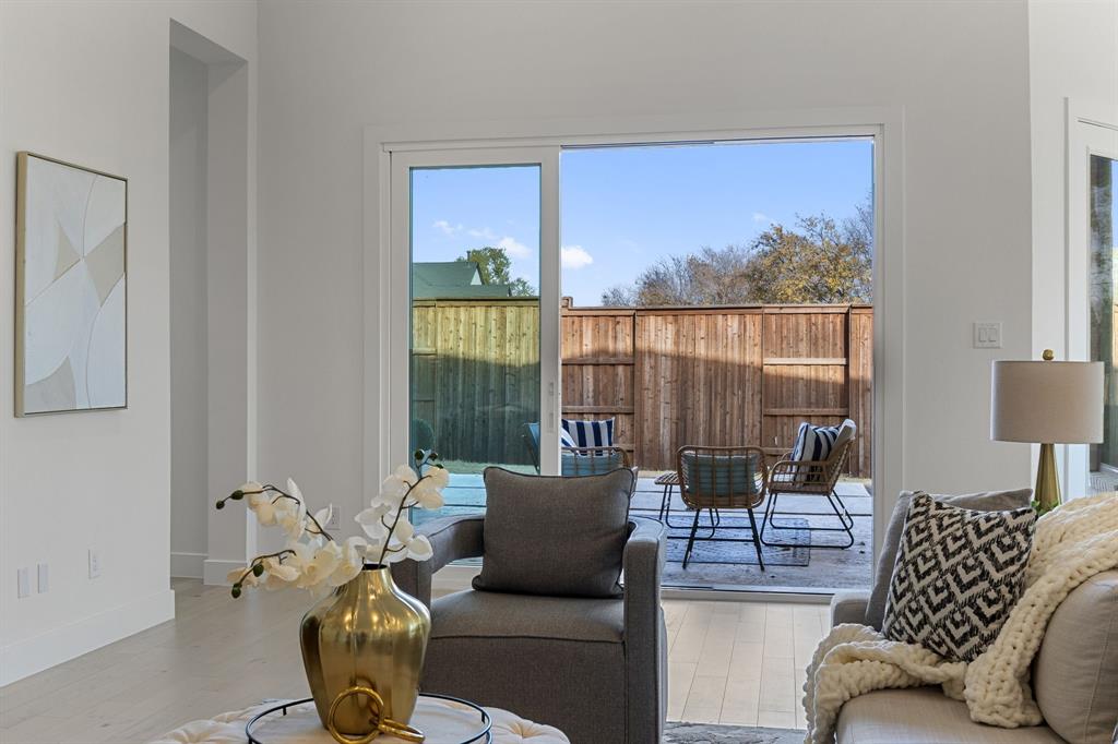 270 Peach Pt Road Prosper, TX 75078 - Photo 13 of 40 a living room with furniture and a floor to ceiling window