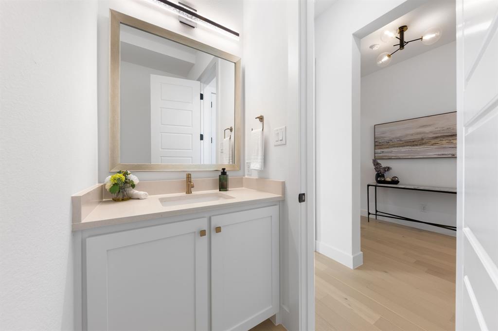 270 Peach Pt Road Prosper, TX 75078 - Photo 15 of 40 a bathroom with a sink and a mirror