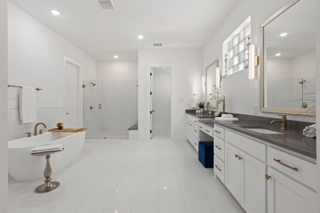270 Peach Pt Road Prosper, TX 75078 - Photo 21 of 40 a spacious bathroom with a double vanity sink a mirror and a shower