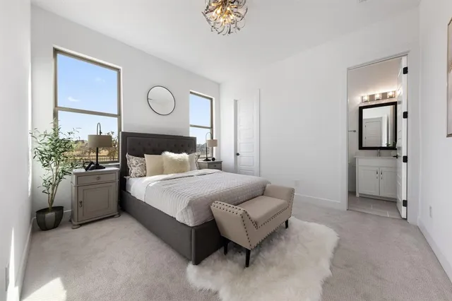 a bedroom with a bed and a couch