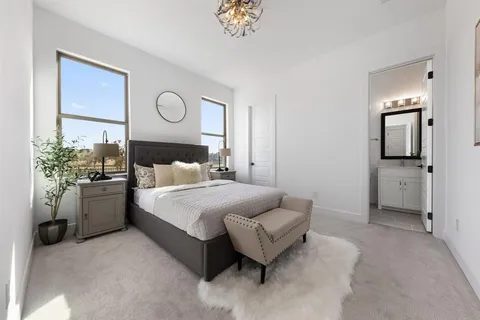 a bedroom with a bed and a couch