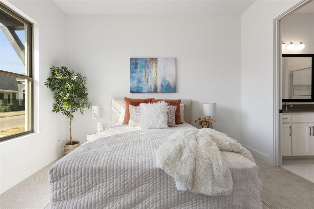 270 Peach Pt Road Prosper, TX 75078 - Photo 27 of 40 a bedroom with a bed and a potted plant