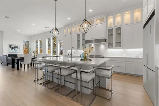 a kitchen with a table and chairs in it