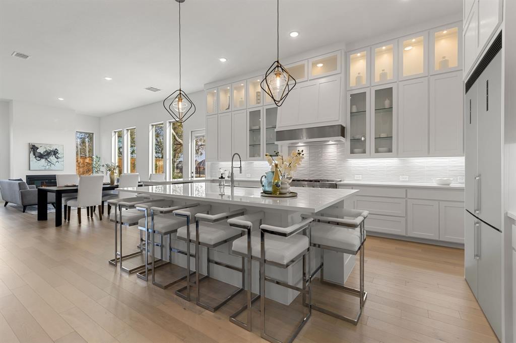 270 Peach Pt Road Prosper, TX 75078 - Photo 3 of 40 a kitchen with a table and chairs in it