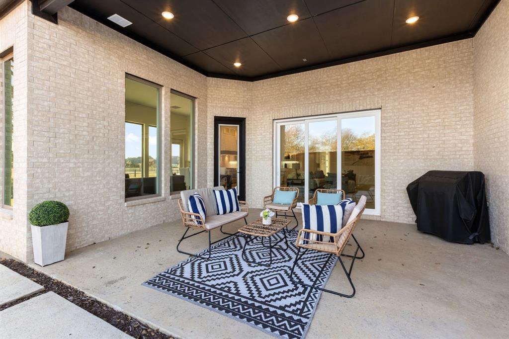 270 Peach Pt Road Prosper, TX 75078 - Photo 33 of 40 a living room with furniture and a potted plant