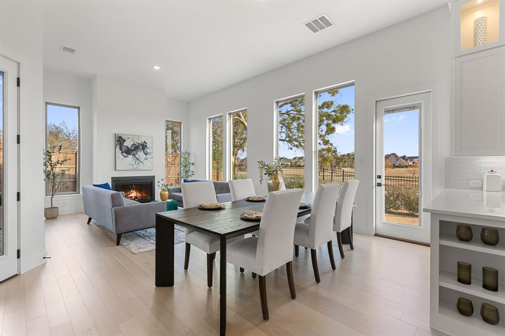 270 Peach Pt Road Prosper, TX 75078 - Photo 9 of 40 a view of a livingroom with furniture window and wooden floor
