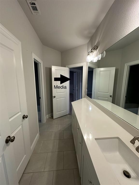 3567 Sevilla Drive Frisco, TX 75034 - Photo 18 of 27 a large bathroom with a tub a sink and mirror