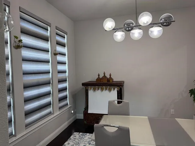 a room with furniture and wooden floor