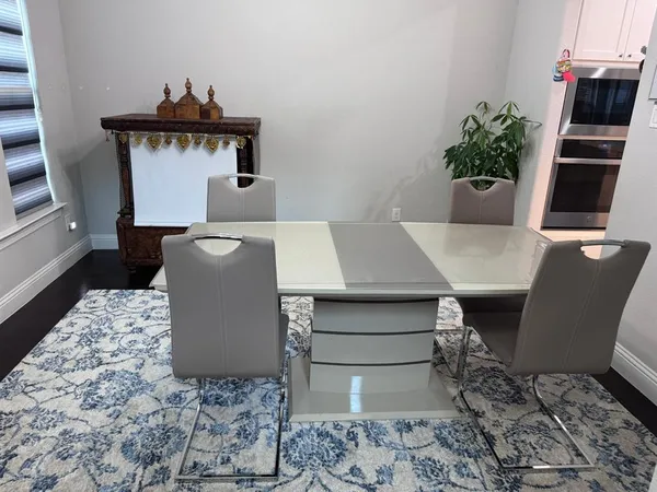 a living room with a couch and a potted plant
